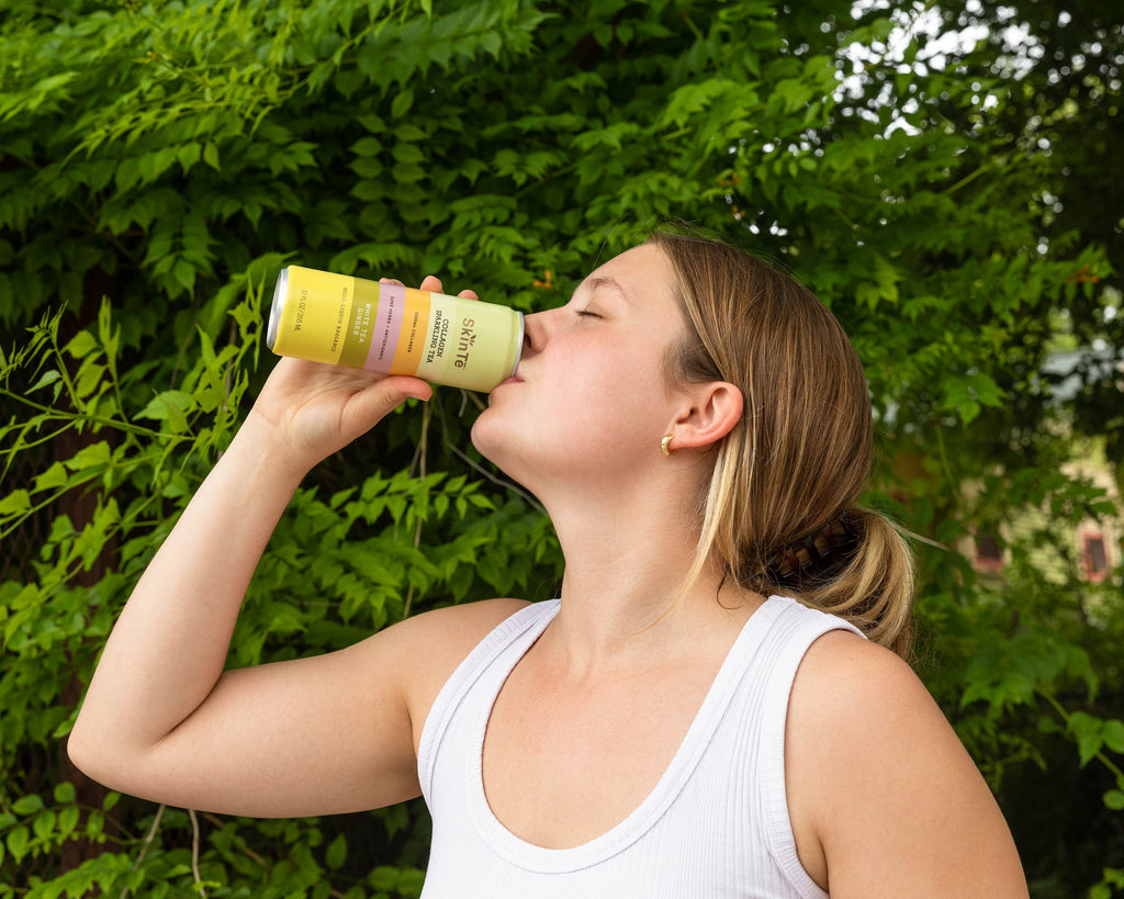 Girl Drinking White Tea Ginger SkinTē